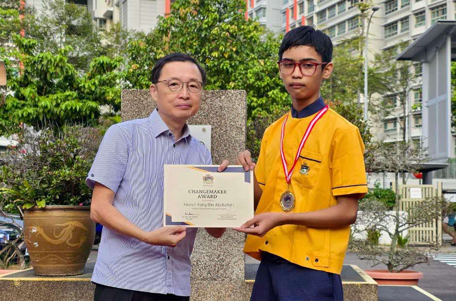 North Vista Primary School Principal Mr Ong Lye Whatt and Firash Faiq Bin Abdullah