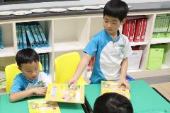 Group Leader - Getting Ready for Lesson (in charge of collecting and distributing of books (640x429)