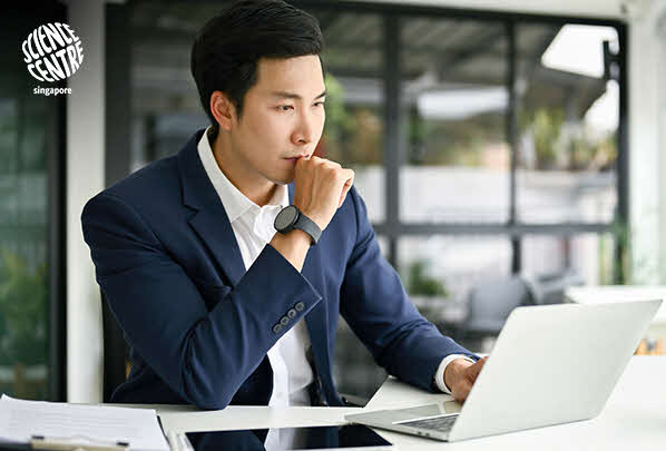 Image of person working on a laptop