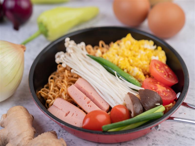 Stir Fried Noodle That Combines Corn Golden Needle Mushroom Tomato Sausage Edamame Spring Onions Frying Pan Fried noodle photo